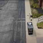 Photo of aerial drone delivering a small package into a custom built mailbox by lowering the item in with a cable.