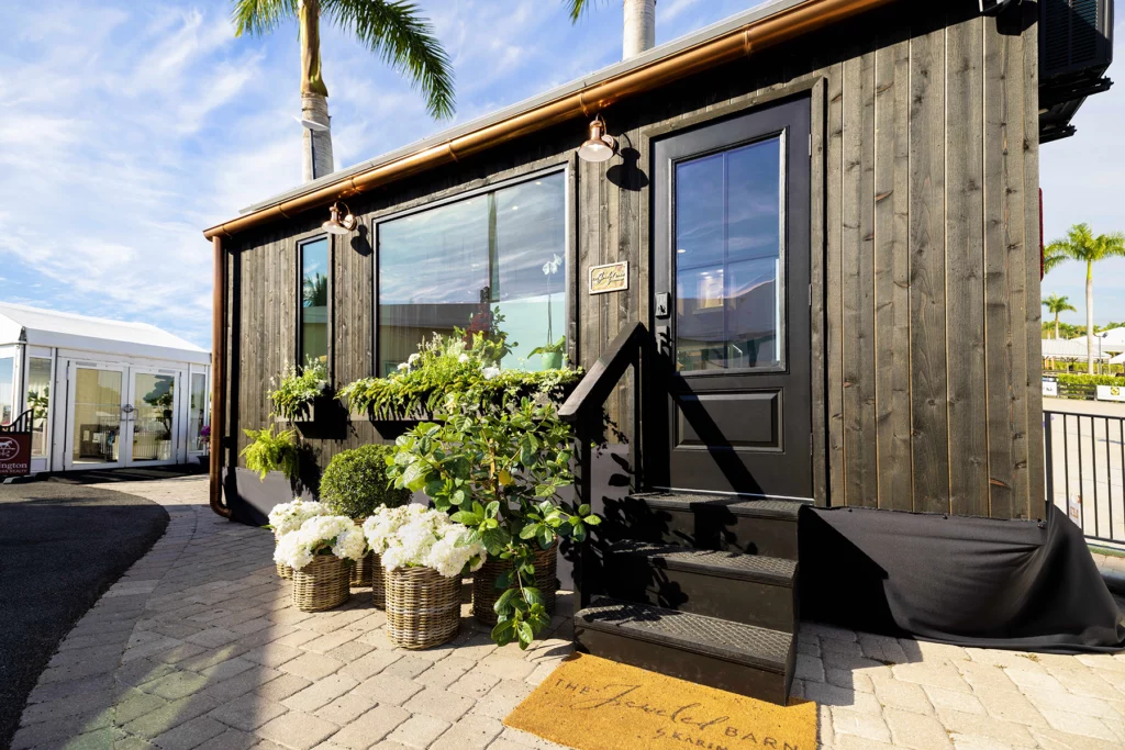 Exterior photo of "The Jeweled Barn," an upscale jewelry store housed in a mobile "tiny home."